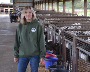 Female dairy farmer in barn
